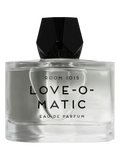 Clear perfume bottle labeled 'Love-O-Matic' by Room 1015 on a black background